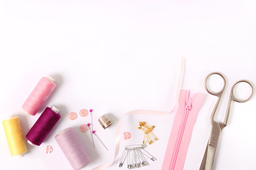 Sewing and Tailoring Tools Flat Lay on White Background
