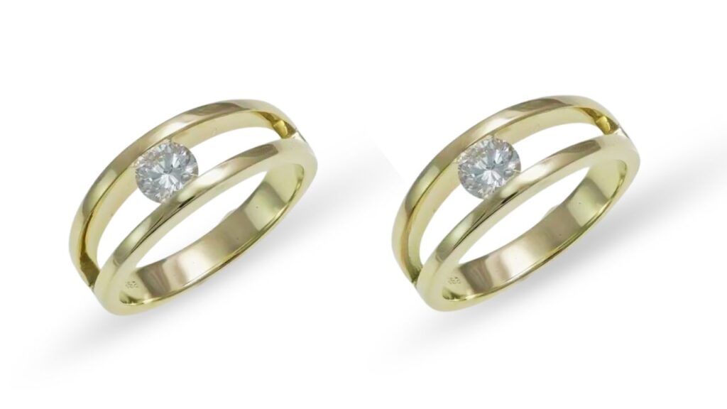 Two gold bands with an elegant split shank design, each featuring a central round diamond, photographed cleanly with unwanted elements removed to highlight their luxury and timeless elegance.