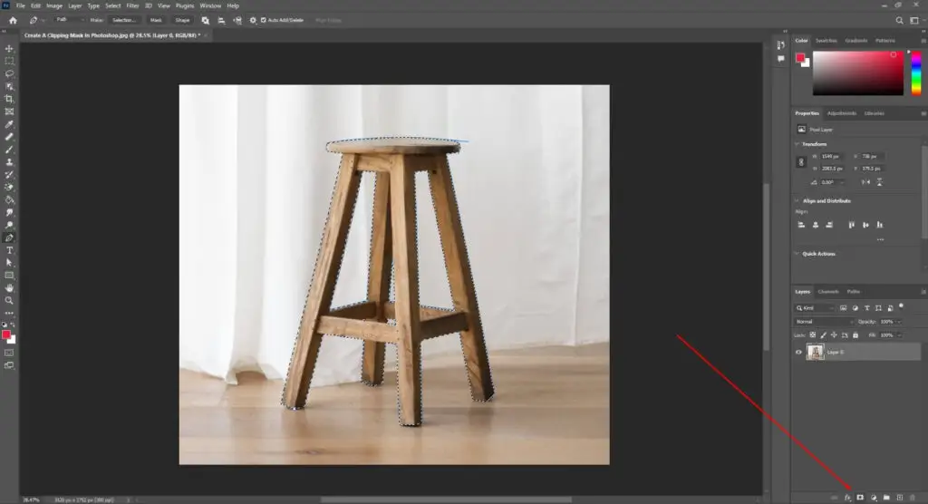 Image of a wooden stool marked with blue line and a red arrow maked in layer mask displayed in adobe photoshop interface.