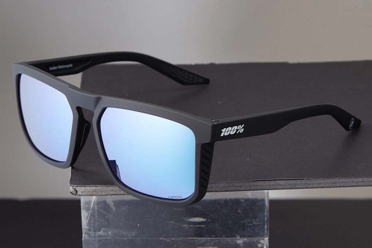 Details of stylish sunglasses with blue mirrored lenses before background replacement