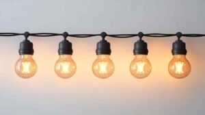 a string of light bulbs hanging from a wire for the product photography lighting setup