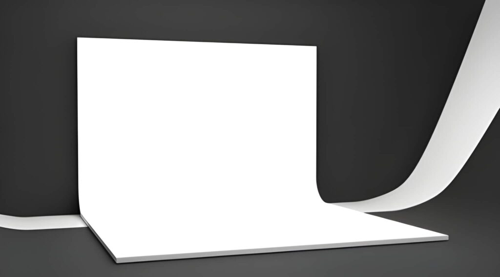 A clean white backdrop with a smooth curve on one side, set against a dark background, ideal for product photography or presentations.