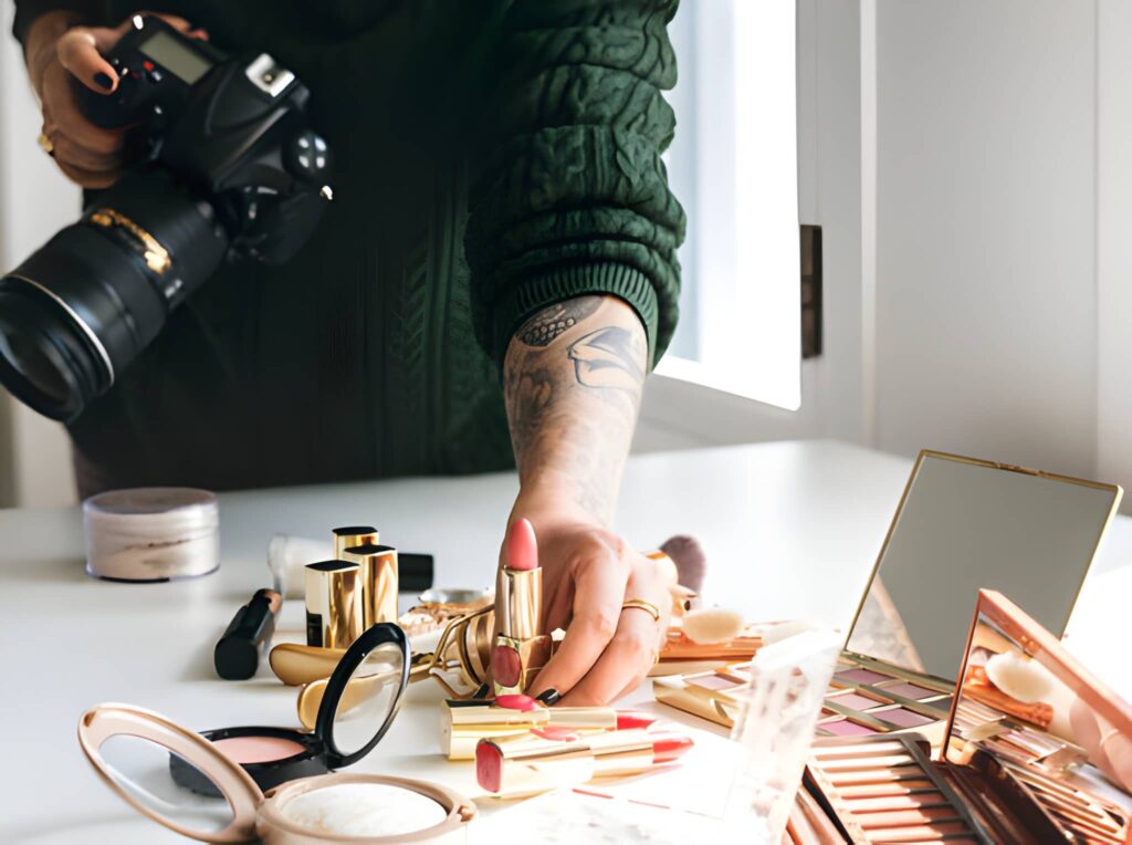 A photographer preparing makeup products for a cosmetics photoshoot.