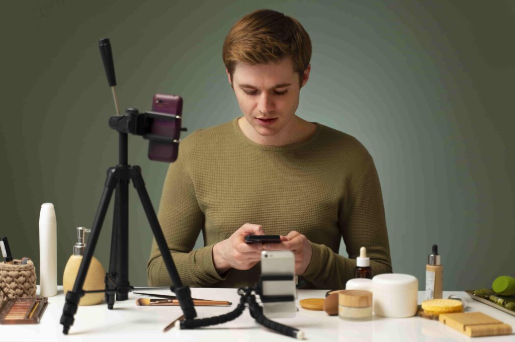 Beginner content creator using smartphone and tripod setup to capture beauty product shots for mobile photo editing practice.