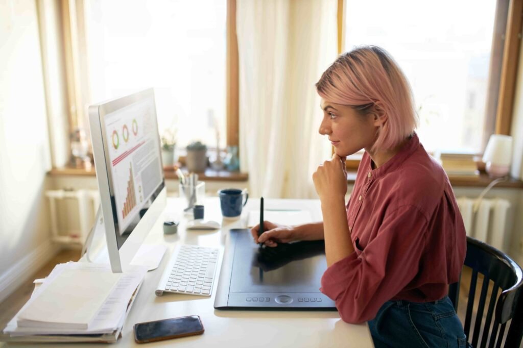 a woman working on a pc