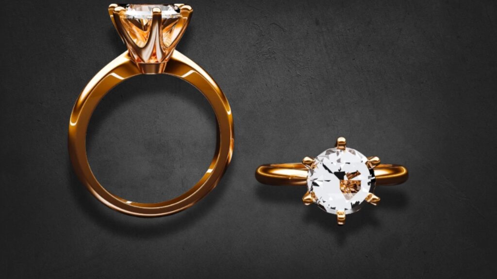 Two elegant gold rings featuring clear diamonds: one with a prominent solitaire setting, the other a classic engagement design.