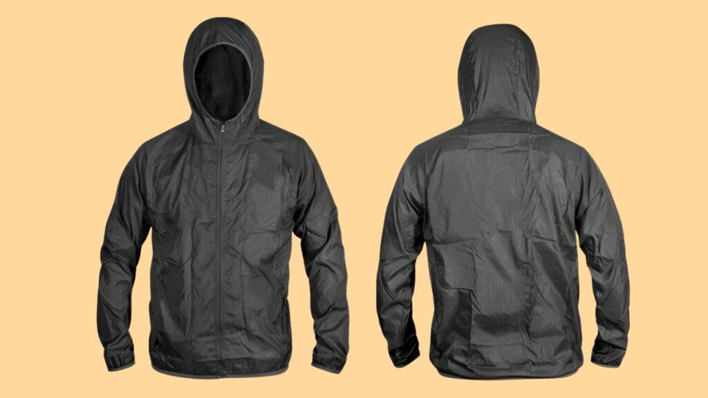 Black lightweight hooded jacket displayed from front and back using invisible ghost mannequin photography on an orange background for a seamless apparel presentation.